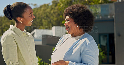Buy stock photo Talking, outdoor and woman with senior mom by home for bonding, connection and relationship. Family, happy and black person with conversation, smile and elderly mother for affection, trust and love