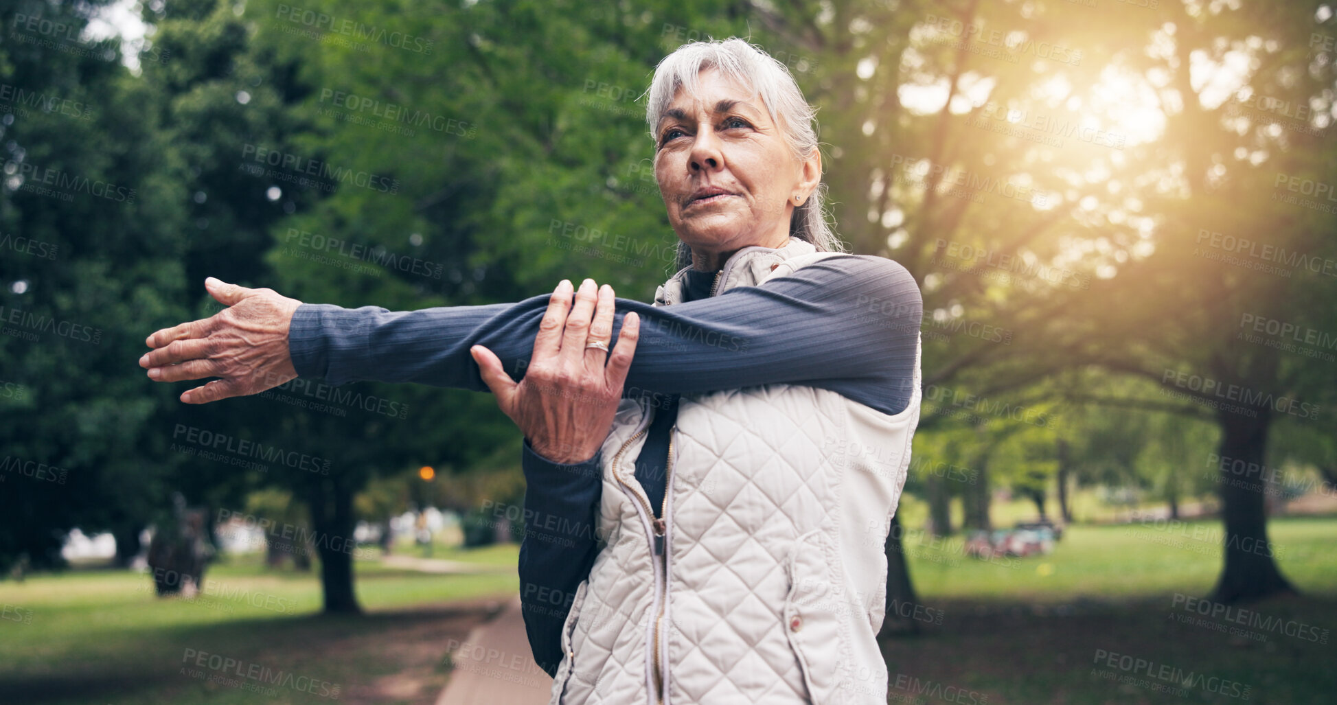 Buy stock photo Serious, old woman and stretching at park for yoga, exercise and training for healthy lifestyle. Thinking, senior person and warm up in nature for pilates, fitness and outdoor workout for wellness