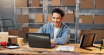 Smile, man and logistics at startup with laptop, research and supply chain for cargo distribution. Happy, person and review in warehouse with tech, stock availability and delivery route for ecommerce