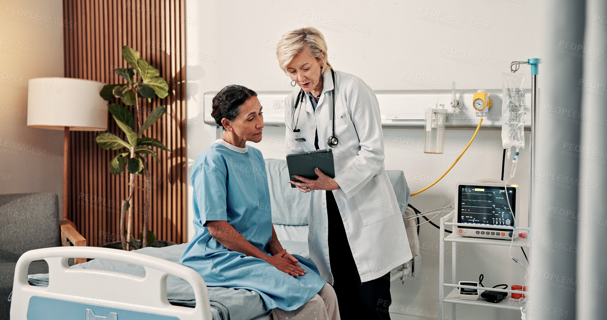 Buy stock photo Doctor, woman and talk on hospital bed with tablet, advice or explain test results for breast cancer. Medical worker, mature people and discussion in clinic with tech, oncology specialist and help.