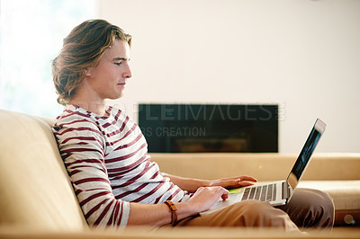 Buy stock photo Laptop, man and student in living room for elearning, knowledge or research for online course. Computer, college and remote education with person in home to study, reading information or assignment