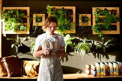 Buy stock photo Cafe, waiter and man on tablet for orders, inventory and stock with seasoning options. Coffee shop, technology and male barista with touchscreen for managing sales and store service in restaurant
