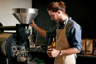 Buy stock photo Coffee, equipment and roasting with man in factory for manufacturing of caffeine produce. Cafe, industry and workshop with employee in kitchen of restaurant for brewing, process or production