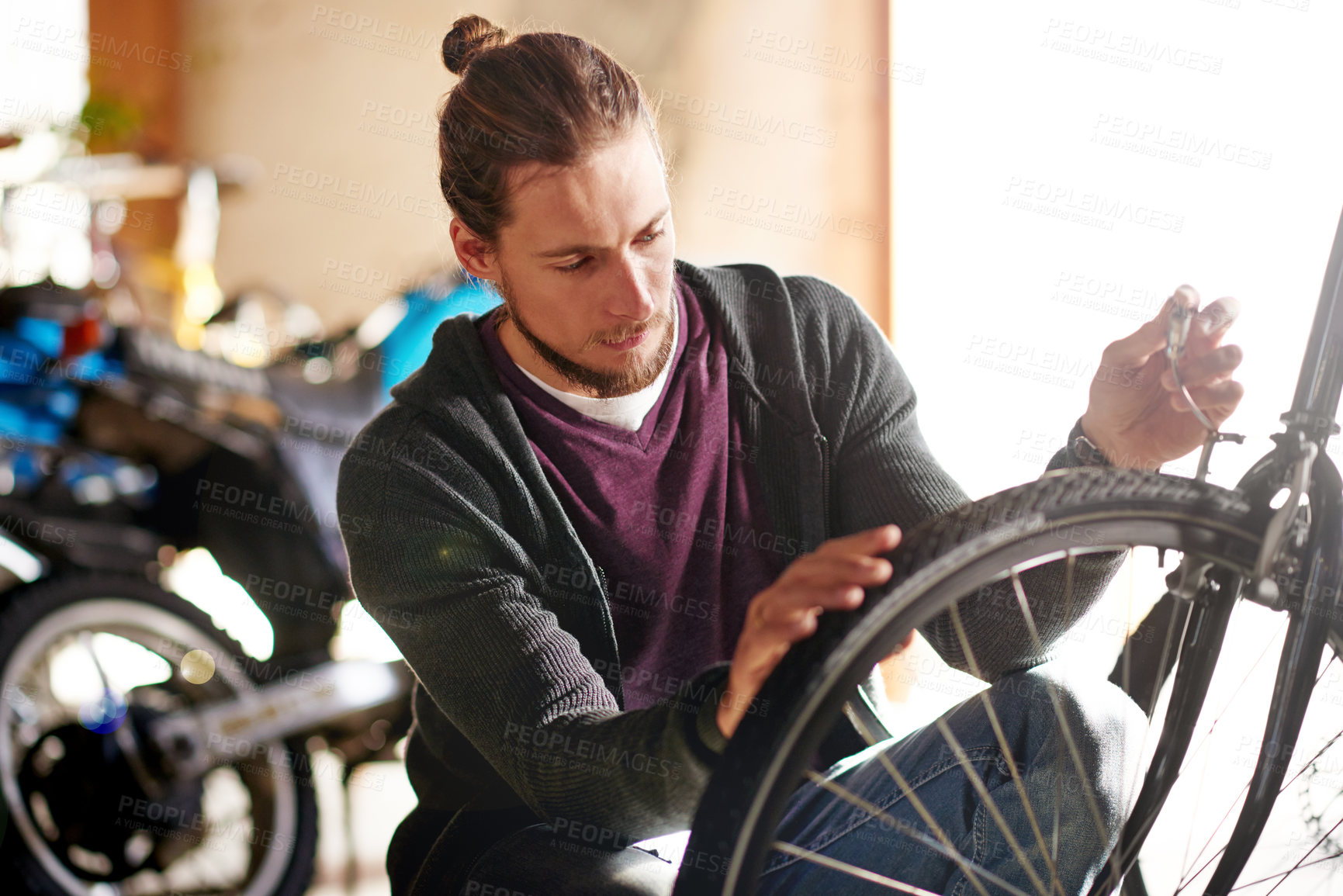 Buy stock photo Man, bike and repair brakes at workshop with cable inspection, maintenance and services at garage. Person, bicycle and safety check with wheel, tyres and gear with restoration job at small business