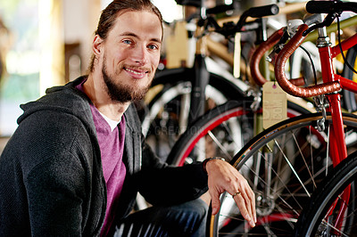 Buy stock photo Bicycle, business and portrait of happy man in store for fixing, repair and selling equipment. Startup, workshop and person with bike for maintenance, cyclist technician and mechanic for gears