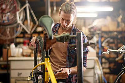 Buy stock photo Man, wheels and bicycle repair at workshop with thinking, equipment and problem solving at small business. Person, technician and bike mechanic with gears, safety check and chain inspection at garage