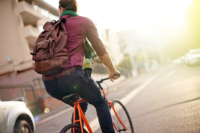 Buy stock photo Travel, adventure and back of man on bicycle in city for commuting, journey or carbon footprint. Street, cycling and person on bike for eco friendly transport on vacation, weekend trip or holiday