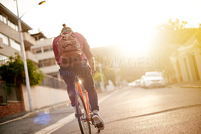 Buy stock photo Travel, journey and back of man on bicycle in city for commuting, adventure or carbon footprint. Street, cycling and person on bike for eco friendly transport on vacation, weekend trip or holiday