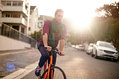 Buy stock photo Travel, commuting and man on bike in city for adventure, journey or carbon footprint on holiday. Street, cycling and person on bicycle for eco friendly transport on vacation in urban town by sunset.