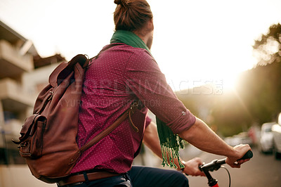Buy stock photo Commute, back or man on bicycle in city for eco friendly transport, ride or entrepreneur. Outdoor travel, morning or designer on road in urban town with sunrise, fashion or bike for creative career 