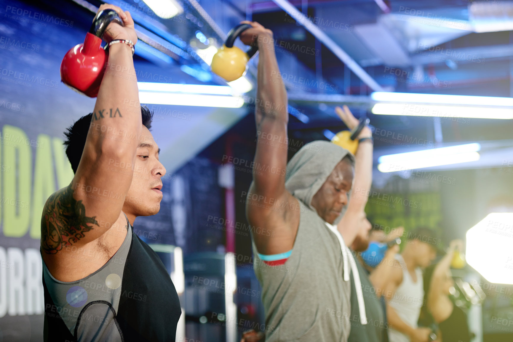 Buy stock photo Fitness class, man and kettlebell workout at gym for core strength, cardio or muscle development. Night, bodybuilder or weightlifting with group for endurance challenge, functional exercise or health