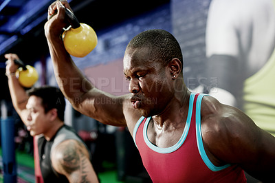 Buy stock photo Fitness class, energy or man with kettlebell at gym for strength training, sweat or intense workout. Group, bodybuilder or weightlifting for endurance challenge, functional exercise and muscle growth