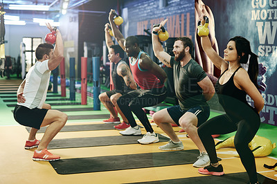 Buy stock photo Gym, personal trainer and kettlebell for exercise, fitness and sports challenge for muscle. People, bodybuilder and heavy weights for training with health club, workout class and athlete group power
