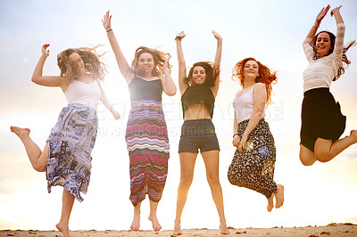 Buy stock photo Freedom, portrait and jump with friends at beach, girl group and happiness with vacation for bonding. fun, energy and excited people with celebration, adventure or travel with summer coastal holiday