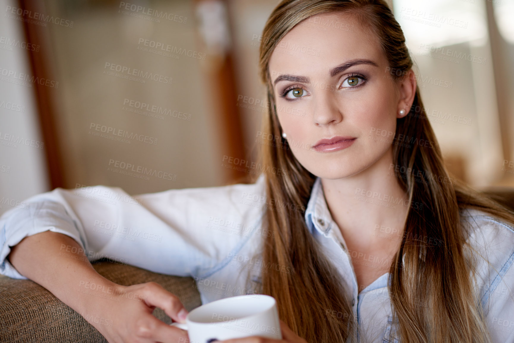 Buy stock photo Serious, coffee and portrait of woman on sofa for calm, peaceful and break in morning at home. Relax, cappuccino and female person drinking warm beverage on weekend in living room at apartment.