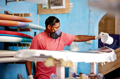 Buy stock photo Workshop, PPE and black man with surfboard, fiberglass and creative for talent and hobby skills. Craftsman, artist and repair with respirator for design, manufacturing and custom work for artisan