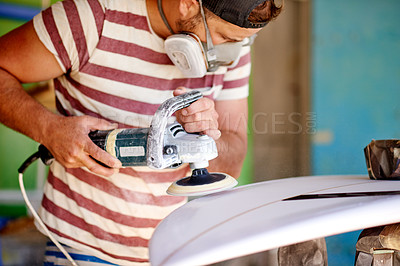 Buy stock photo Manufacturing, man and sanding surfboard for production process, design or shape. Surf, factory and person with electric tools to polish foam for creative craftsmanship with respirator in workshop