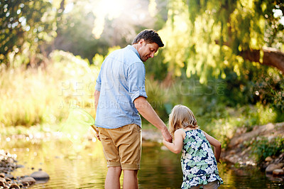 Buy stock photo Pond, father and daughter holding hands in nature with help, connection and adventure for development. Care, parent and child outdoor at creek with bonding together, support and search for tadpoles.