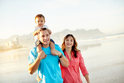 Buy stock photo Travel, parents and baby on shoulder at beach for holiday adventure, walking together or hug. Happy family, portrait or dad carry child on seashore for weekend trip, vacation support or mockup space