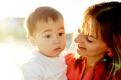 Buy stock photo Happy, woman and bonding with child, outdoor and mom on holiday with son, relax and family on break. Parent, love or care for toddler on vacation, flare and together on weekend, smile and affection