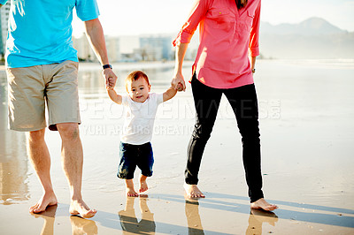 Buy stock photo Toddler, parents and holding hands at beach for bonding, together and travel in nature. People, mom and dad with boy kid, walking on shore or adventure by ocean with family vacation in Argentina