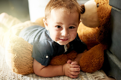 Buy stock photo Home, portrait and child with teddy bear, comfortable and cozy with fluffy toy, resting and toddler. Happy, boy and adorable with plush, stuffed animal or relax on floor, growth or development in USA