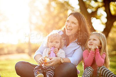 Buy stock photo Relax, mother and children in park with smile, bonding and adventure for summer holiday and vacation. Happiness, family and picnic in nature with flare, garden and food in outdoor on weekend.