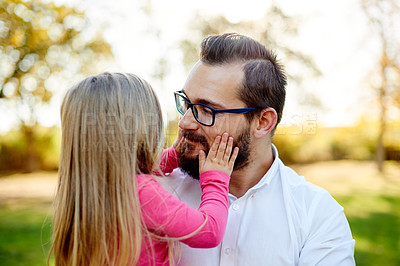 Buy stock photo Outdoor, love and father with girl, nature and bonding together with conversation. Family, parent and dad in park, daughter and child development with holiday, listening and care with weekend break