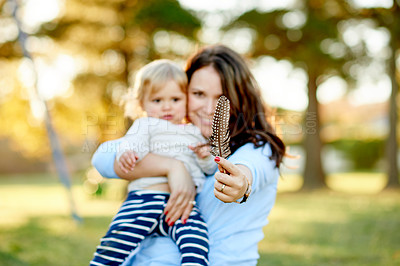 Buy stock photo Outdoor, child and mom with smile, playground or feather for game in nature or bonding with toddler. Portrait, woman and break with daughter on weekend, family and childcare on holiday, park and fun