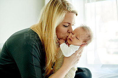 Buy stock photo Love, mom and kiss baby in home for connection, bonding together and protection in nursery. People, newborn and new mother with affection in bedroom for early childhood development and relationship