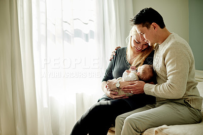 Buy stock photo Bedroom, family and parents with child in home for loving relationship, bonding and affection. Space, parenting and happy mom, dad and newborn baby in house for security, trust or connection together