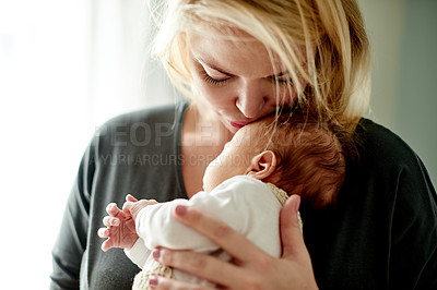 Buy stock photo Mother, kiss and newborn baby in home with affection, bonding or relationship growth for love of family. Woman, infant with holding or hug in house, moment or care with new mom for motherhood