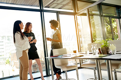 Buy stock photo Women, coffee break and friends in startup for chat, collaboration or gossip in office. Talking, business and people in conversation together with team for networking, brainstorming or planning ideas