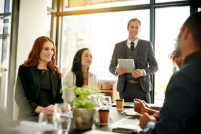 Buy stock photo Boardroom, group and man with tablet, meeting or new ideas for funding opportunity or communication. Office, people and account manager with tech for investment strategy, talking and business growth