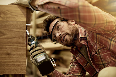 Buy stock photo Woodwork, drill and man in workshop for frame production, cupboard or manufacturing process. Small business, building and creative carpenter with power tools in warehouse for craft or manual labor