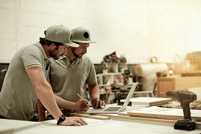 Buy stock photo Carpentry, collaboration and laptop with men in workshop together for industrial design or planning. Computer, conversation and woodworking with people in factory for cabinetmaking or joinery