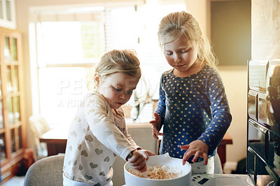 Buy stock photo Baking, learning and children in kitchen in home for bonding, connection or cooking on weekend. Happy, mixing bowl and girl kids with preparing dough for cookies, biscuits or dessert together.