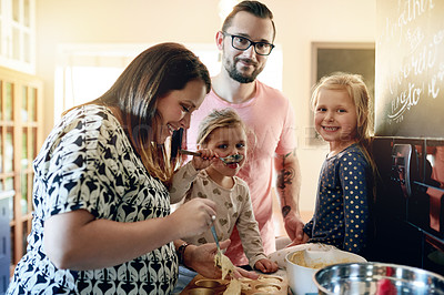Buy stock photo Baking, smile and muffins with family in kitchen for support, cooking and learning dessert recipe. Teaching, bonding and food with parents and children in home for cupcake, love and portrait together