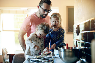 Buy stock photo Father, kids and learning to bake cookies with dough on tray, help and together with family. Children, dad and baking with parent in home kitchen, teaching recipe and dessert preparation with girls