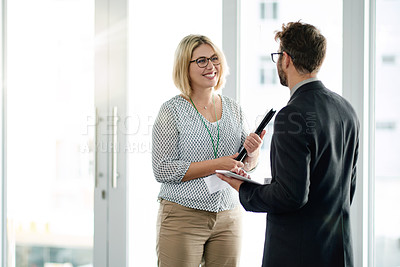 Buy stock photo Happy, manager and employee at window with tablet for feedback review, communication and project collaboration. Digital app, discussion and people in workplace with tech, teamwork or strategy meeting
