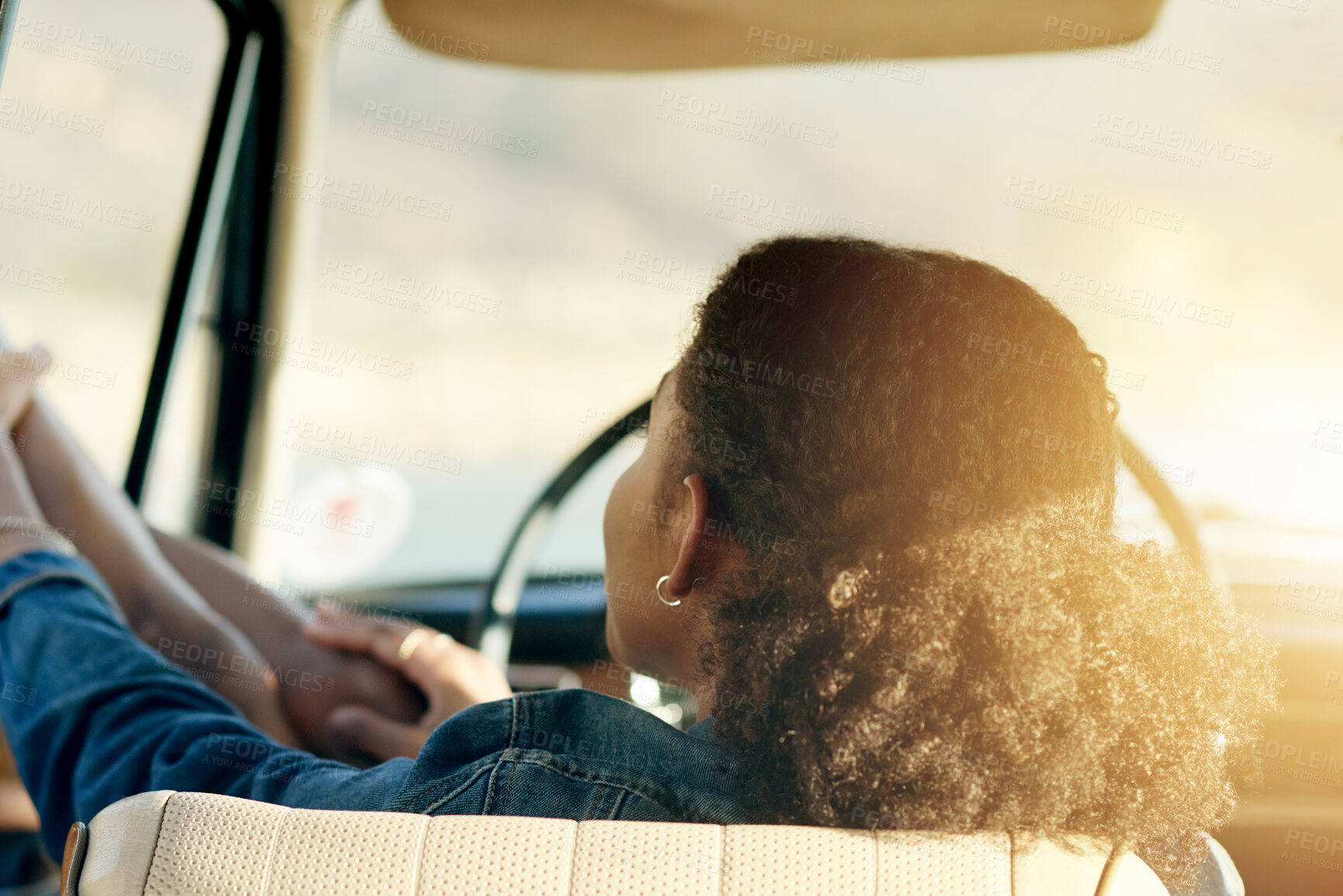 Buy stock photo Road trip, sunshine and back of woman in car for adventure, holiday and vacation in countryside. Relax, flare and person in vehicle with legs in window for journey, sightseeing and summer getaway