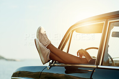 Buy stock photo Shoes, window and road trip with car at beach with vacation, travel or relax on getaway journey. Legs, feet and rest on break, ocean view and vehicle for transportation, sky or space with flare