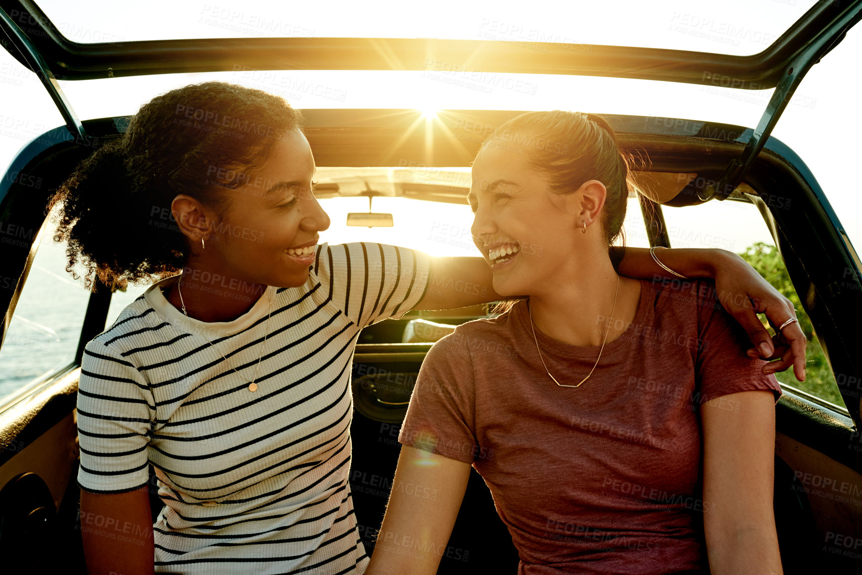 Buy stock photo Road trip, sunshine and women in car happy on summer holiday, vacation and adventure in countryside. Friends, flare and people hug in vehicle for bonding on journey, tourism and travel destination