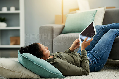 Buy stock photo Woman, relax and floor with tablet at house for research, browsing social media or reading ebook. Female person, digital and screen for surfing internet, streaming film and entertainment subscription