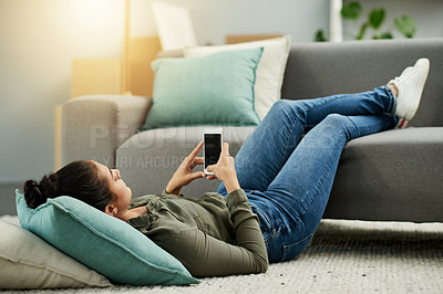 Buy stock photo Woman, relax and floor with phone at house for research, browsing social media and reading ebook. Female person, mobile and screen for surfing internet, texting contact and entertainment subscription