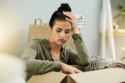 Buy stock photo Woman, sad and packing with box for mistake, home repossession or eviction notice. Frustrated, female person or depression for unpaid mortgage debt, lease violation or property inflation in house