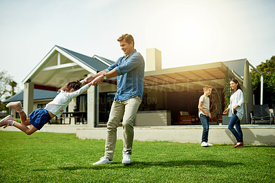 Buy stock photo Outdoor, family and dad swinging child in home garden for bonding, connection and fun together. Happy, love and father spinning and playing with girl kid on weekend in backyard of house in summer.