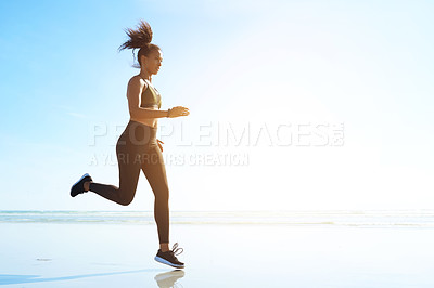 Buy stock photo Fitness, woman and running at beach for workout, body wellness and health with mockup space. Ocean, runner and cardio training outdoor for endurance challenge, exercise or sports with flare in nature