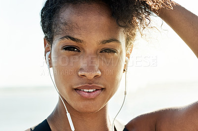 Buy stock photo Portrait, fitness and woman with earphones, beach and music for training routine, athlete and break. Outdoor, runner and African person with tech for audio, rest and workout with playlist in nature