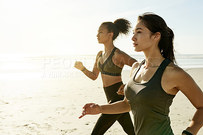 Buy stock photo Exercise, women and friends running at beach for workout, training and health outdoor with flare. Team, fitness and runners by ocean together for endurance, cardio and jog for sports with space